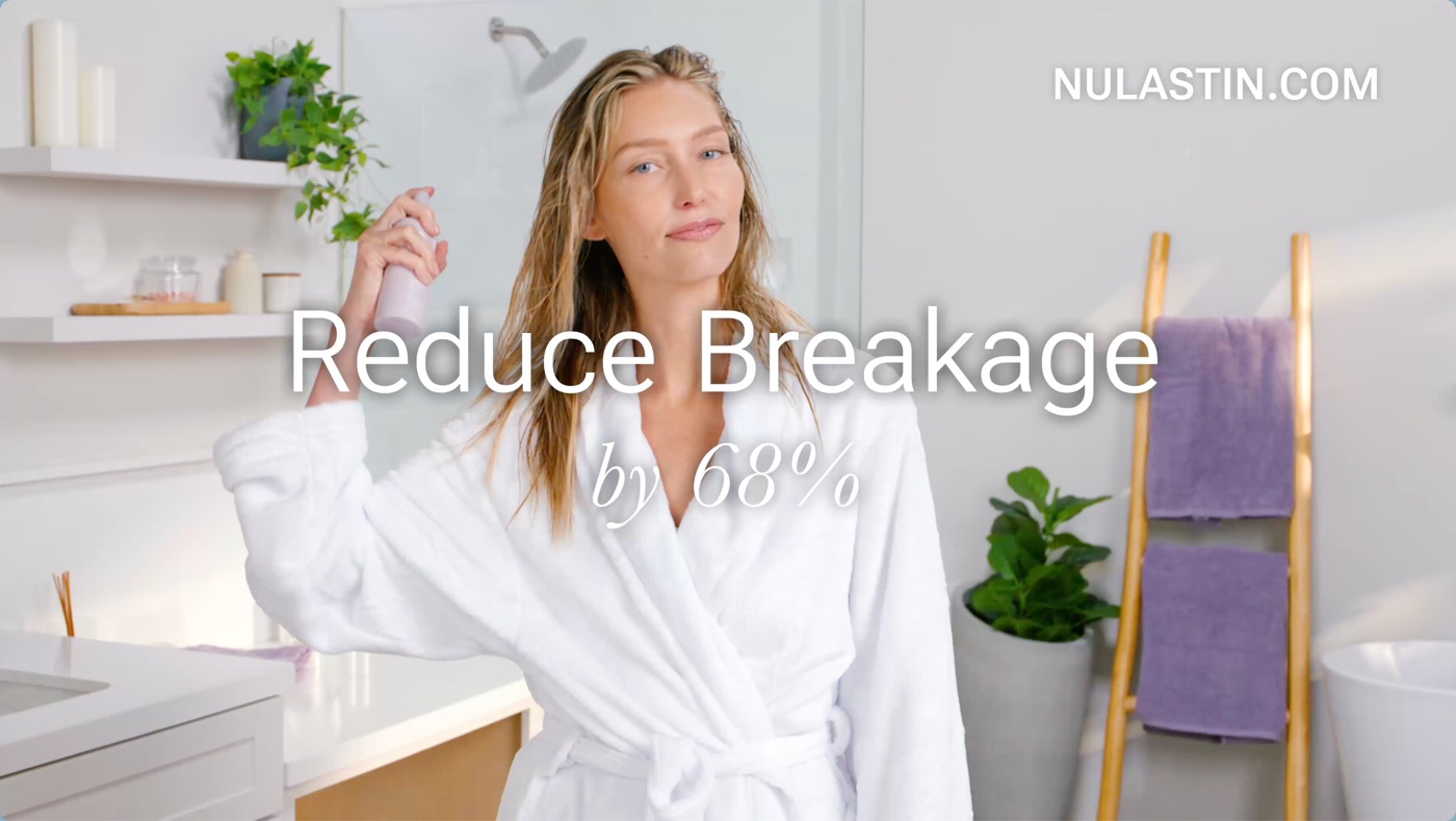 Haircare commercial playing full screen on a living-room TV